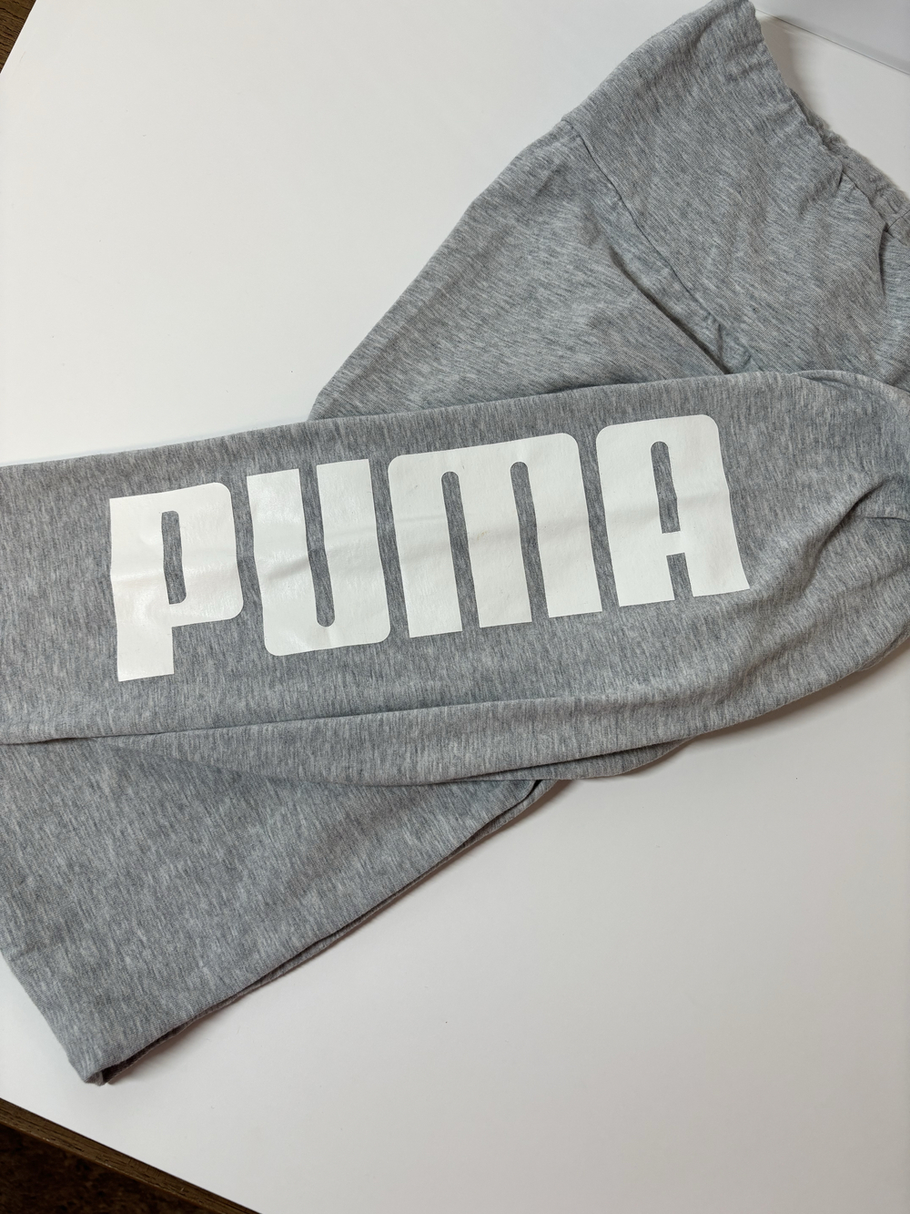 Puma grey logo sweatpants with wide waistband and leg graphic. Size LG
